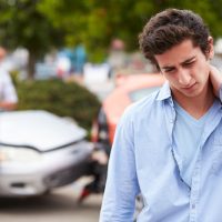 Teenage Driver Suffering Whiplash Injury Traffic Accident