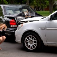 Frustrated woman covering head, car accident despair, driver suffering stress