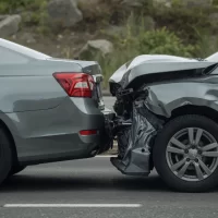 a-rearend-collision-between-two-grey-cars-on-a-road[1]