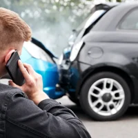 a-man-holding-his-neck-is-on-the-phone[1]