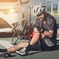 cyclist-in-gear-sits-on-the-road[1]