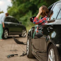 male-and-female-drivers-after-car-accident-on-road[1]